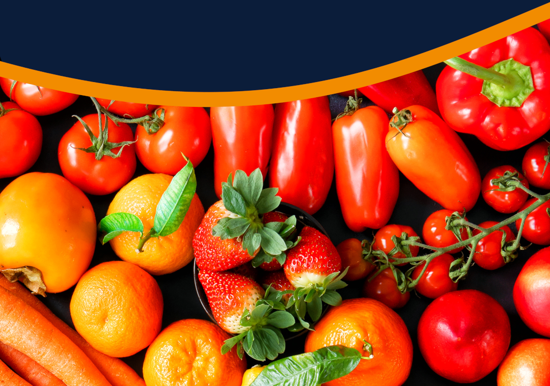 A background photo of various colourful fruit and vegetable